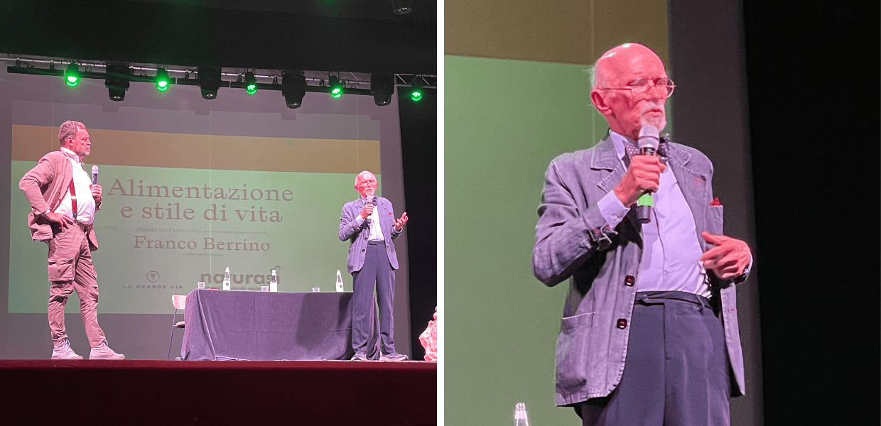 Franco Berrino parla di alimentazione e stile di vita durante una conferenza, esplorando temi di salute e benessere sul palco.